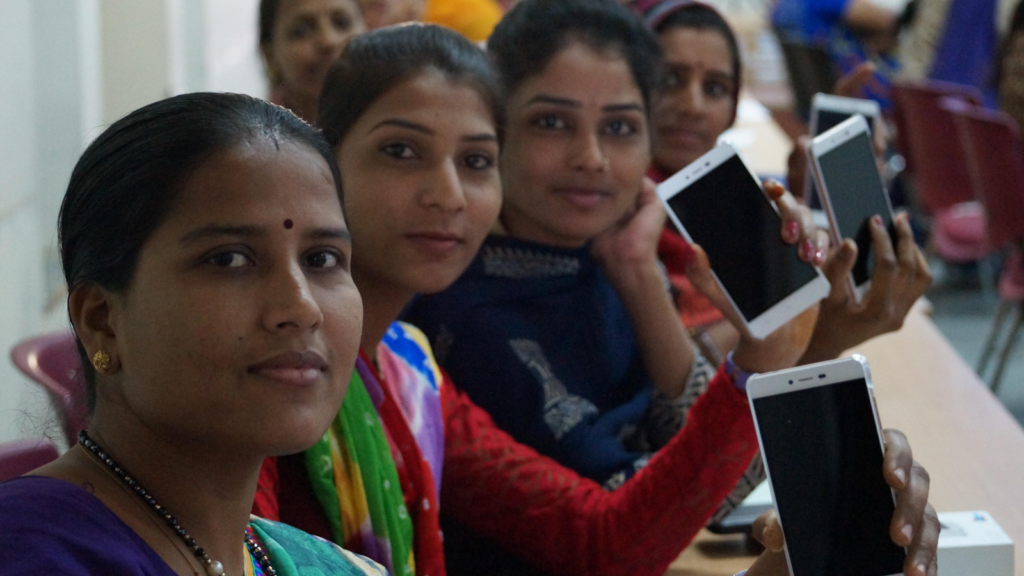 PMA blog featured image A group of people at a table with smartphones