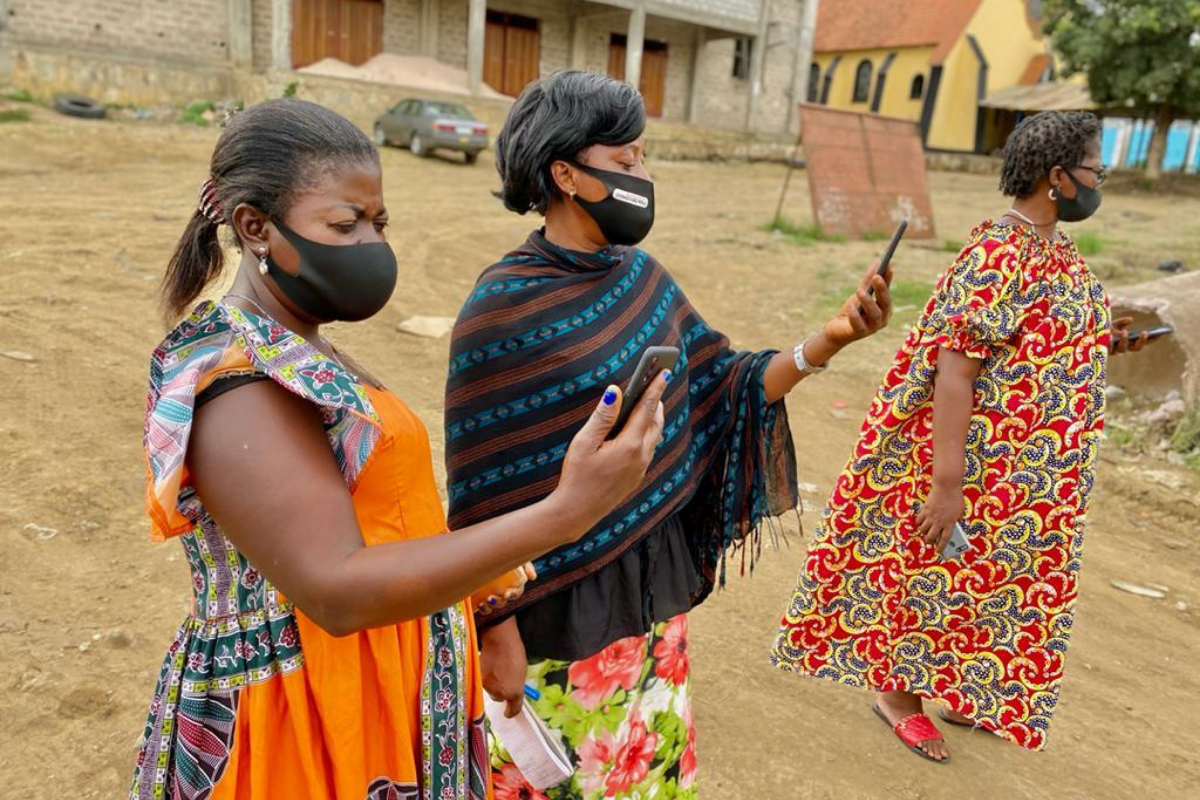 PMA-Female-Resident-Enumerators-on-Phones-with-Maskes