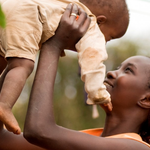 mother-lifting-child-150×150
